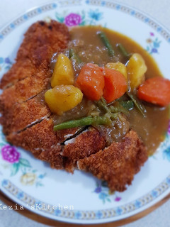 A picture of Chicken Katsu With Curry Sauce.