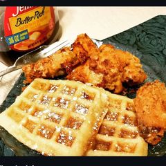 A picture of Chicken and Waffles with Honey Butter.