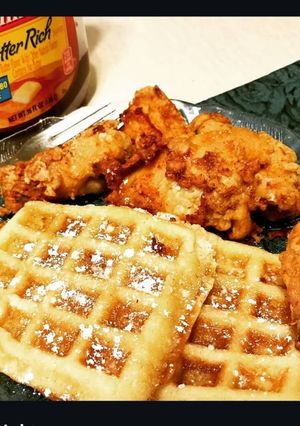 A picture of Chicken and Waffles with Honey Butter.