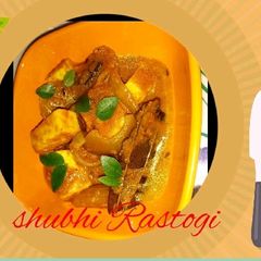 A picture of Spicy Gravy with Paneer onion.