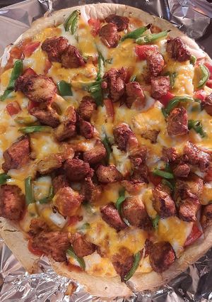 A picture of Super duper Yummy Pizza with a taste full of Deliciousness 🍕🍷.
