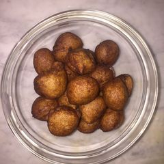 A picture of Banana fritters or banana balls.