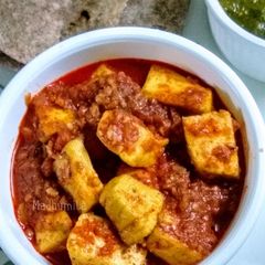 A picture of Paneer in Tomato Gravy.