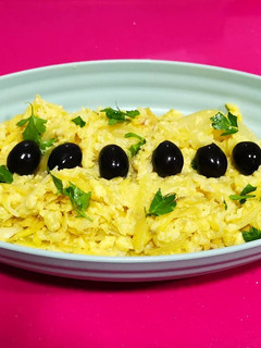 Una foto de Bacalao dorado o bacalhau a brás