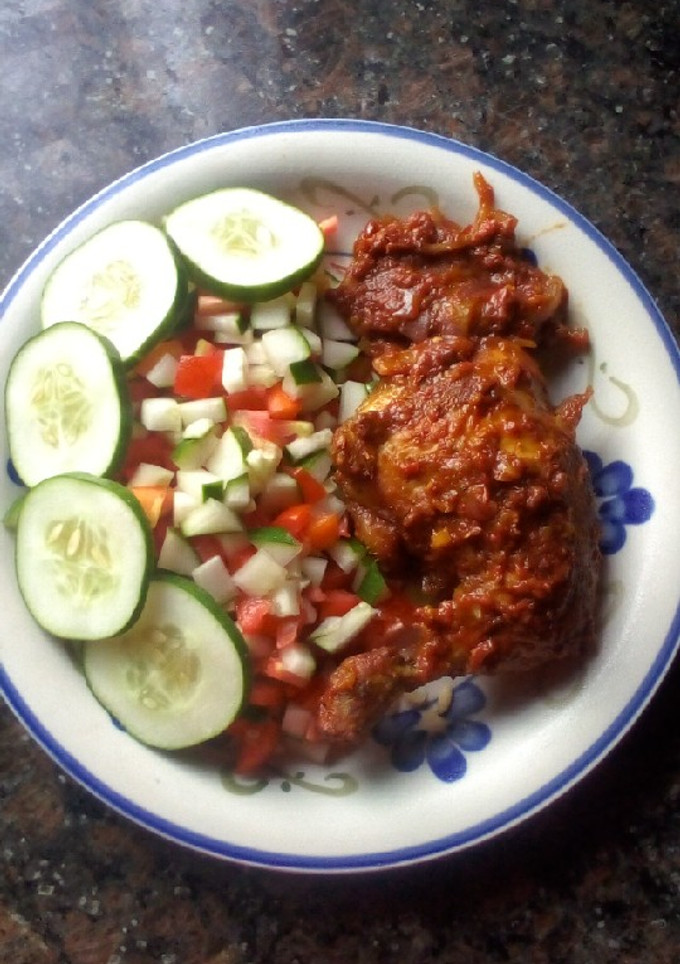 A picture of Peppered chicken with cucumber and tomato salad.