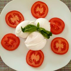 A picture of Caprese salad of Buffalo mozzarella.