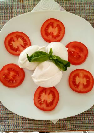 A picture of Caprese salad of Buffalo mozzarella.
