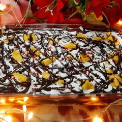A picture of Mango, chocolate, strawberry trifle.