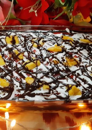 A picture of Mango, chocolate, strawberry trifle.