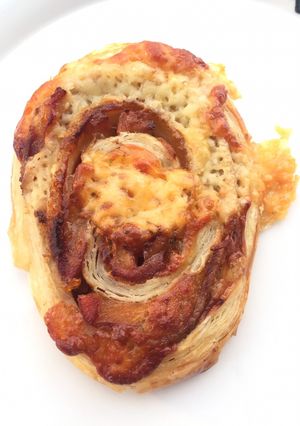 A picture of Roasted Pork With Korean Dried Persimmon Roll Top Passion Fruit Coulis.