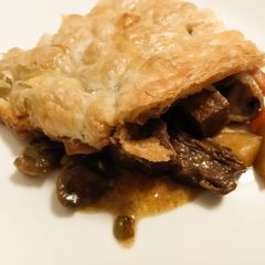 A picture of Steak and mushroom pot pie.