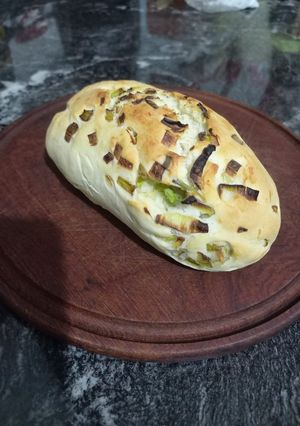 Una foto de Pan saborizado con cebolla y verdeo