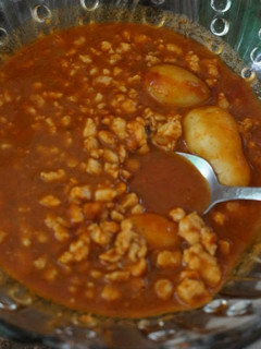 Una foto de Mole de picadillo de cerdo y papas