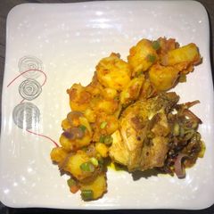 A picture of Stir fry potato with grilled chicken.