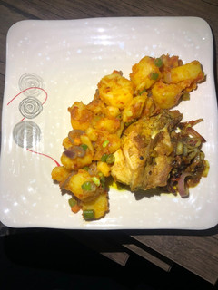 A picture of Stir fry potato with grilled chicken.