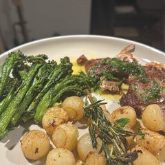 A picture of Lemon Butter lamb with Parisian potatoes and spiced broccolini’s.