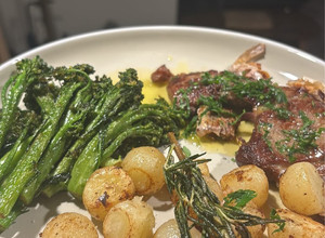 A picture of Lemon Butter lamb with Parisian potatoes and spiced broccolini’s.