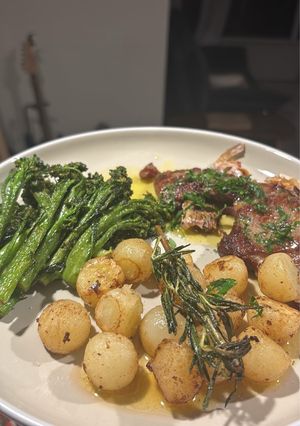 A picture of Lemon Butter lamb with Parisian potatoes and spiced broccolini’s.