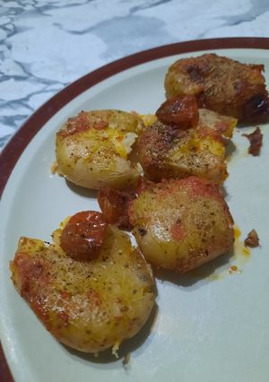 Una foto de Papines andinos con aceite de Dende y cherry explotados