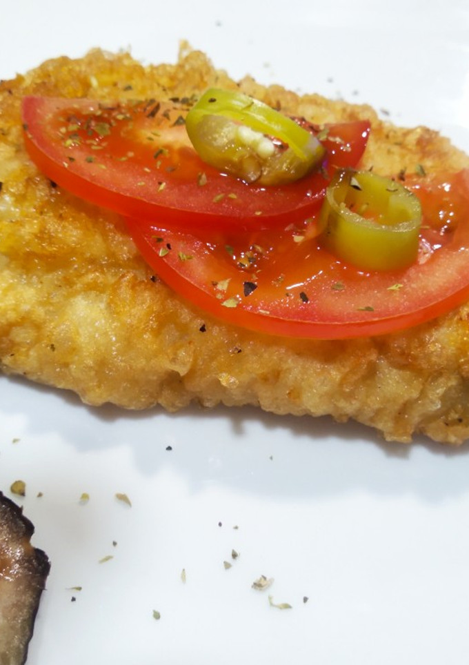 Una foto de Boquerones rebozados con tomate, salsa de ostras y guindilla