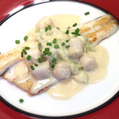 A picture of Pan Fried Fish with Creamy Scallops.