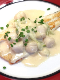 A picture of Pan Fried Fish with Creamy Scallops.