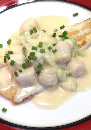 A picture of Pan Fried Fish with Creamy Scallops.