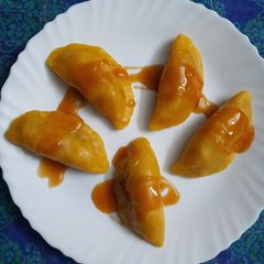 Palm dumplings stuffed with sweetened coconut A picture of Palm dumplings stuffed with sweetened coconut.