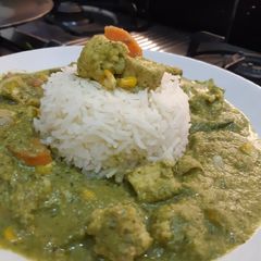 A picture of Green Thai Curry With Steamed Rice.