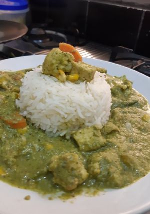 A picture of Green Thai Curry With Steamed Rice.