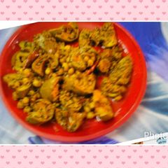 A picture of Raw mango pickle with chickpeas.
