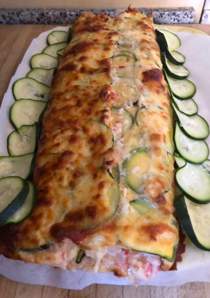 Una foto de Brazo gitano de calabacín con Gambones y bocas de mar