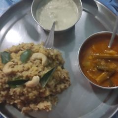 A picture of Samai Pongal with narial chutney and Sambar.