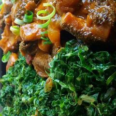 Matumbo served with vegetables A picture of Matumbo served with vegetables.