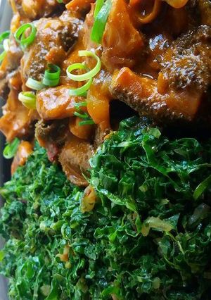A picture of Matumbo served with vegetables.