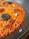 Arroz con panceta, salchichas y butifarra negra