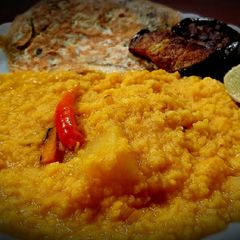 A picture of Rainy day platter- khichdi, Omelette and fried brinjal.