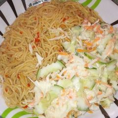 A picture of Spaghetti with coleslaw.
