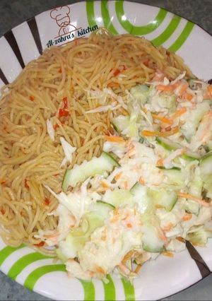 A picture of Spaghetti with coleslaw.