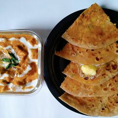 Multigrain aloo paratha with paneer butter masala A picture of Multigrain aloo paratha with paneer butter masala.