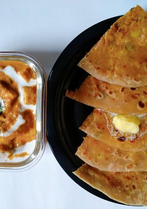 A picture of Multigrain aloo paratha with paneer butter masala.
