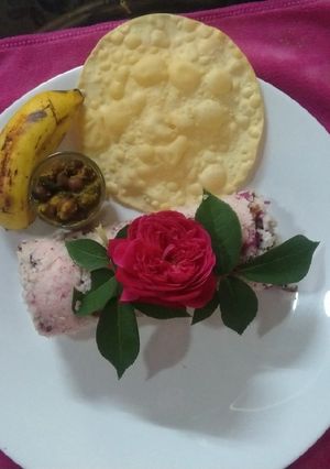 A picture of Steamed Gulkanda Rice Puttu,Chenna,Pappad &Banana.