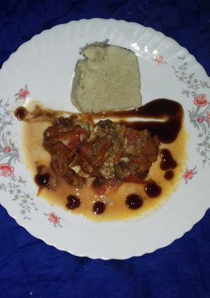 A picture of Cornbread with fish stew.