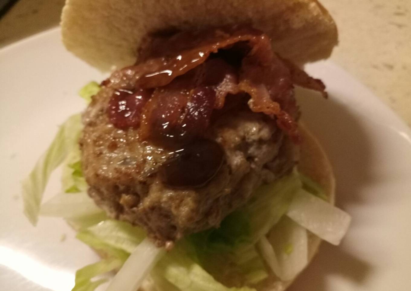 Homemade sage & onion pork burger with bacon and HP brown sauce