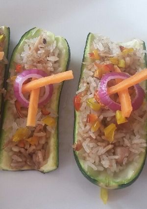 A picture of Zucchini stuffed with chicken rice.