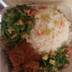 Rice and Stew with fish and salad A picture of Rice and Stew with fish and salad.