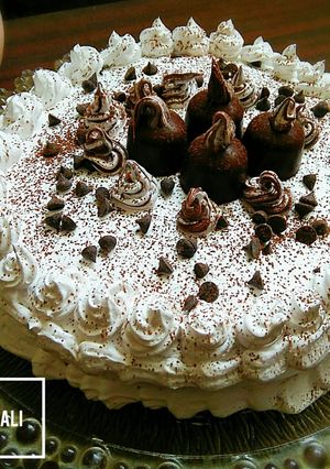 A picture of Chocolate sponge cake in pateela on stove.