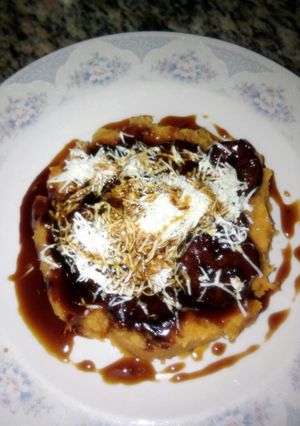 Una foto de Plátano Dulce en cama de Puré de Batata Amarilla y Queso