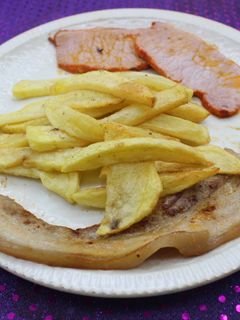 Una foto de Lomo de cerdo adobado con panceta