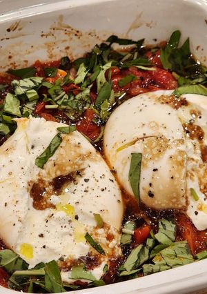 A picture of Baked Burrata with Roasted Tomatoes,Olive Oil and White Wine Vinegar.